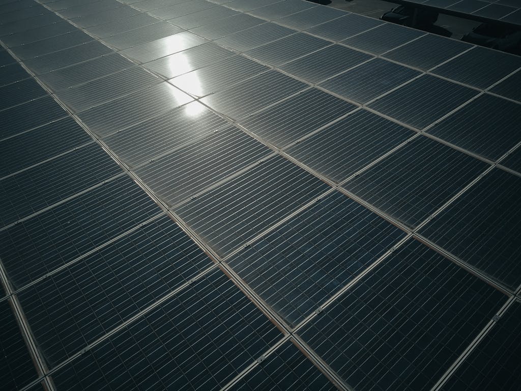 Captivating close-up of solar panels reflecting sunlight, showcasing renewable energy technology.